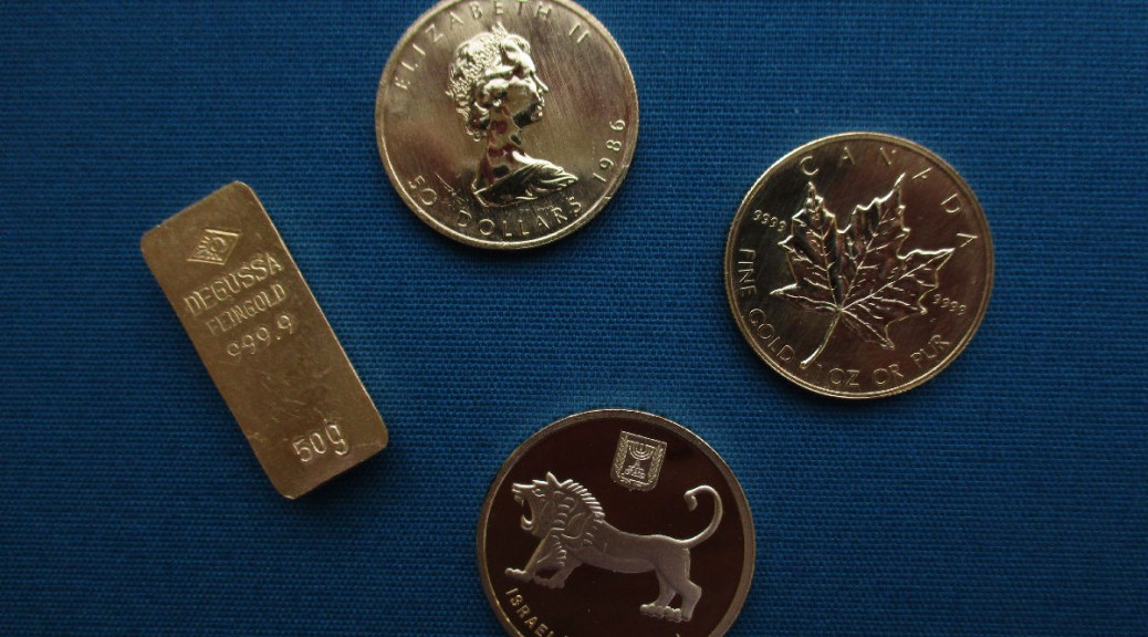 Diverse Goldmünzen und Goldbarren