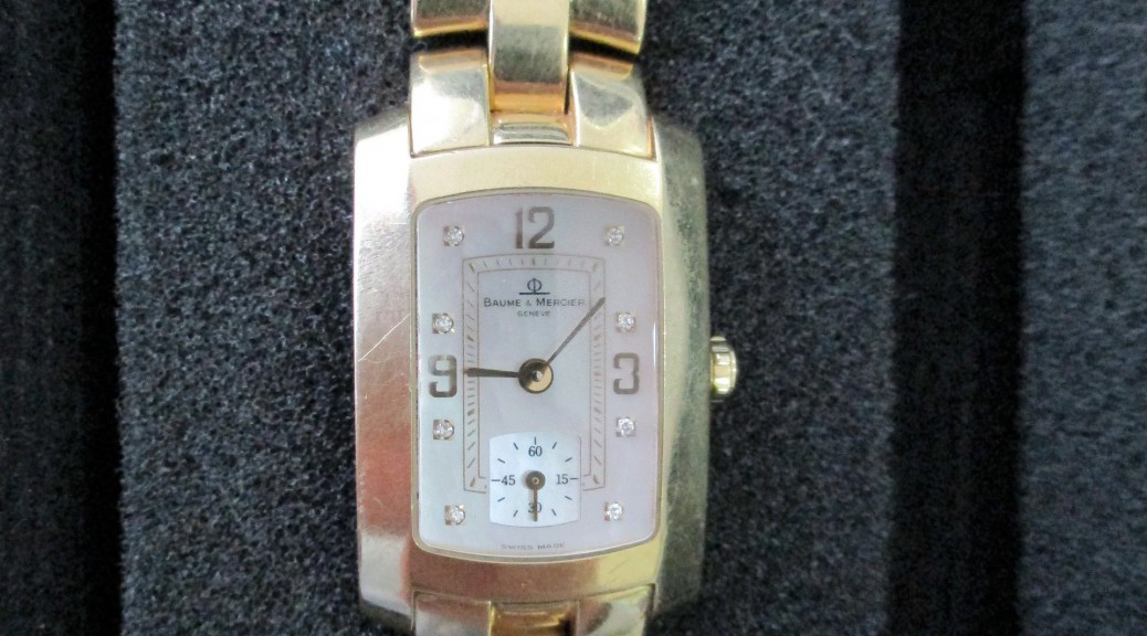 Goldene Armbanduhr Baume & Mercier